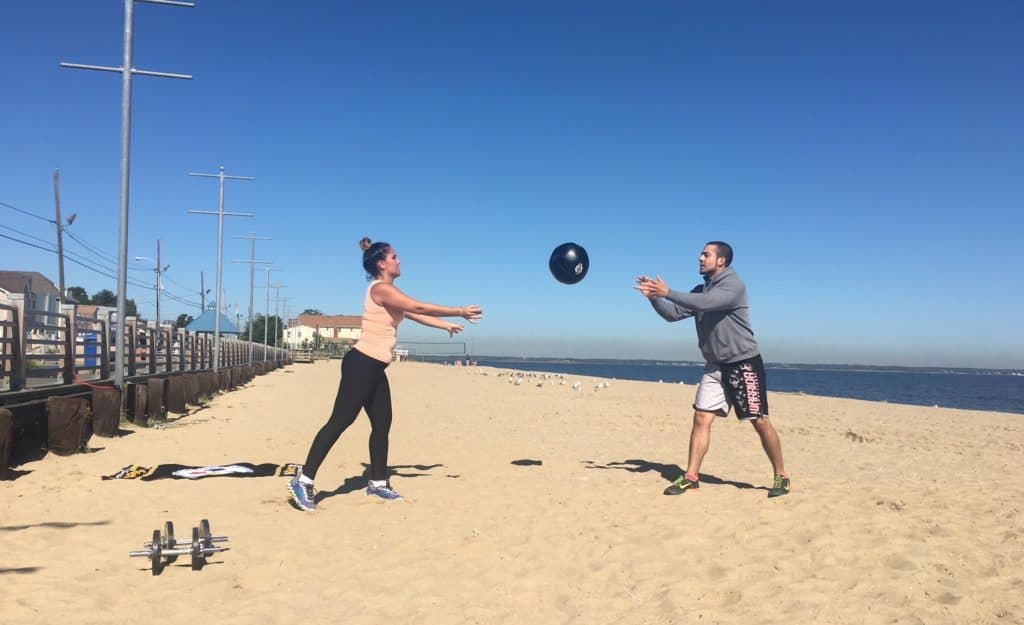 personal trainer working with client