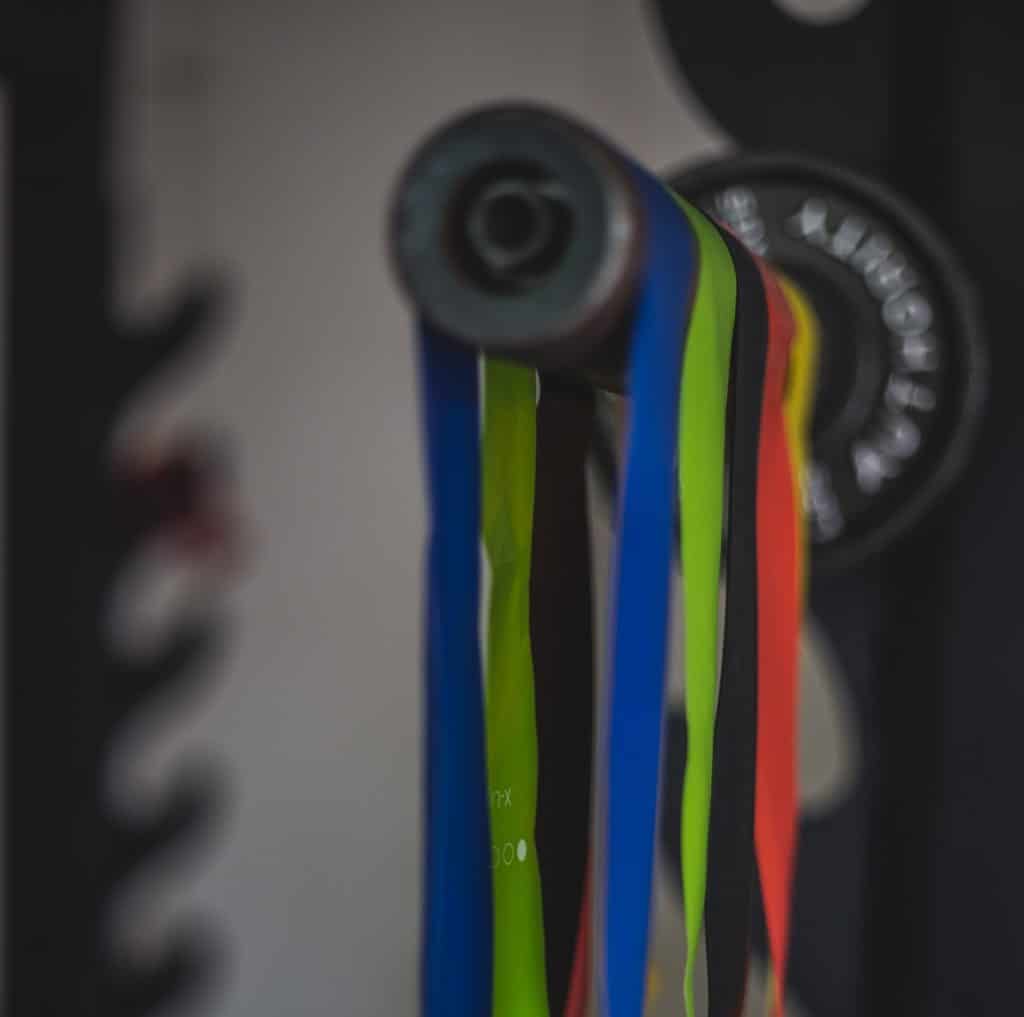 Resistance bands attached to barbell