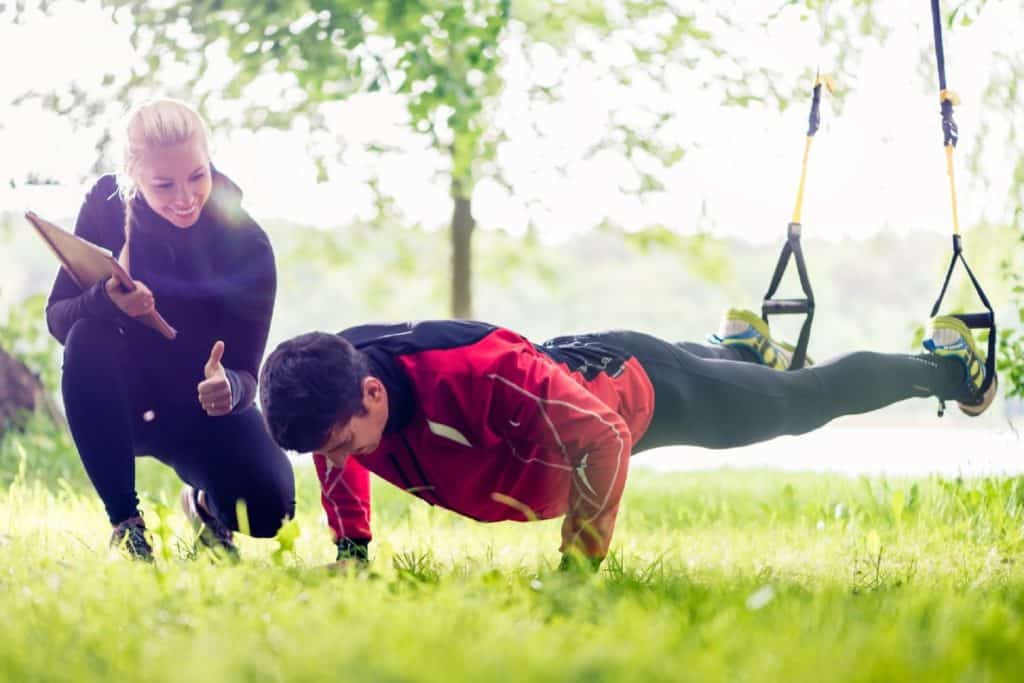 personal trainer and client training together