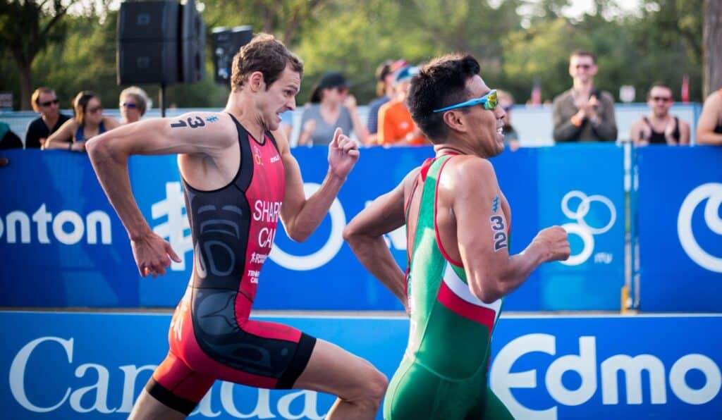 Two triathlon athletes running